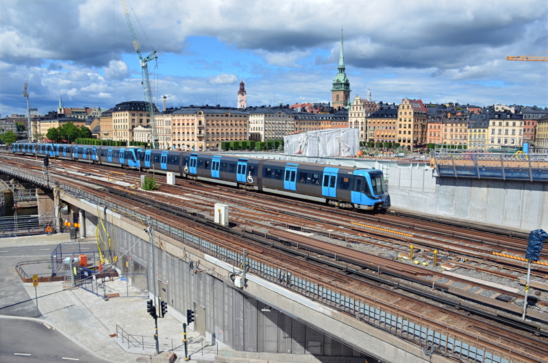 15 - An SL C20 stock train traveling on the Söderströmsbron bridge between Gamla Stan and Slussen stations in Stockholm